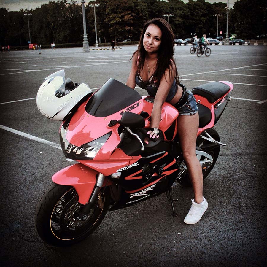 Brunettes on a motorcycle in Dnepr